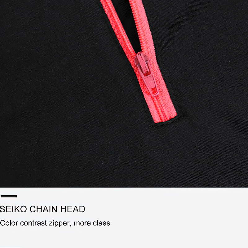 Close-up of a thermal top with half zipper; vibrant red zipper on black fabric; perfect for outdoor fitness and staying dry.
