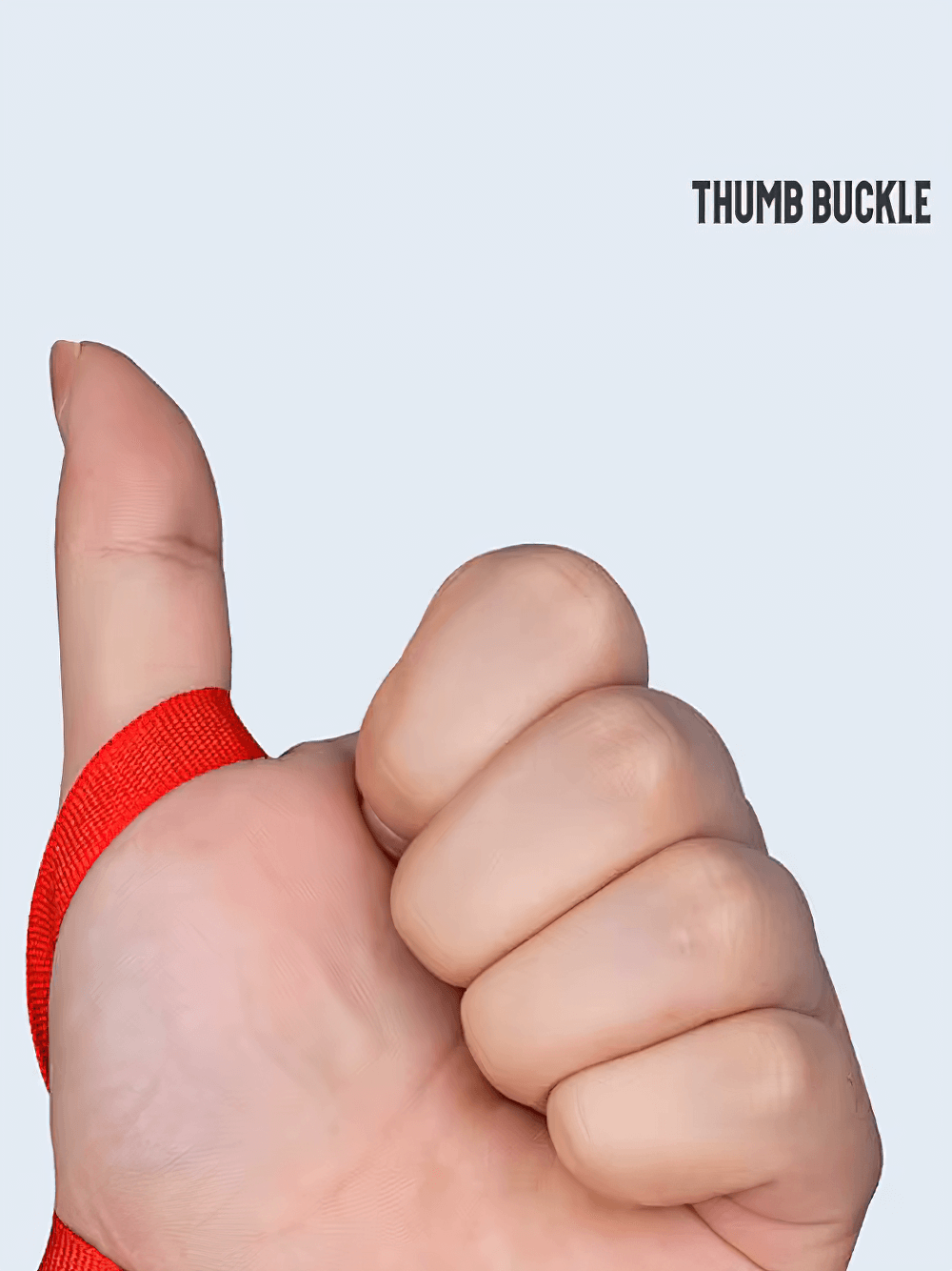 Close-up of thumb wearing red boxing hand wrap with thumb buckle for secure fit.