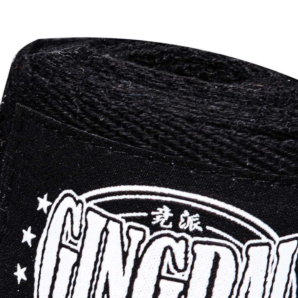 Close-up of durable black boxing hand wrap with stylish logo detailing, designed for ultimate hand and wrist support in training.