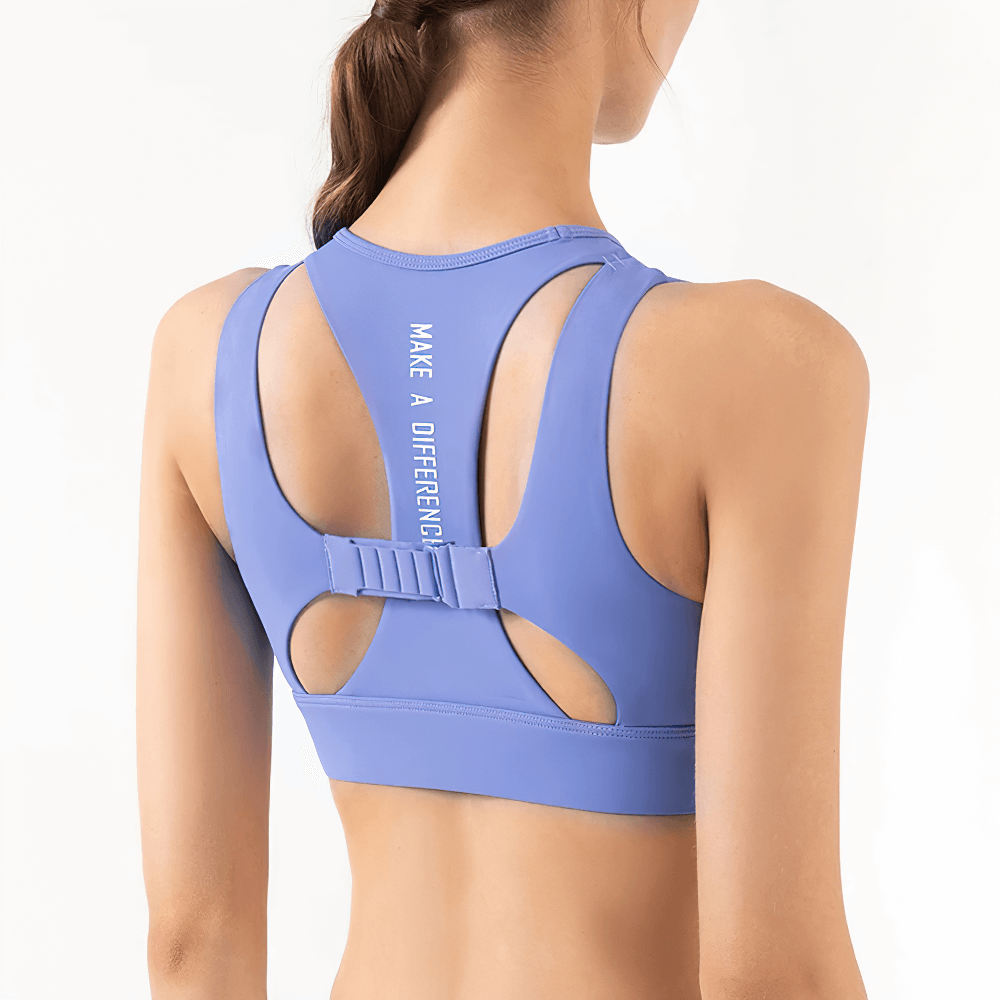 Back view of a woman wearing a blue high-impact sports bra for yoga with quick-dry fabric, featuring a stylish cutout design.