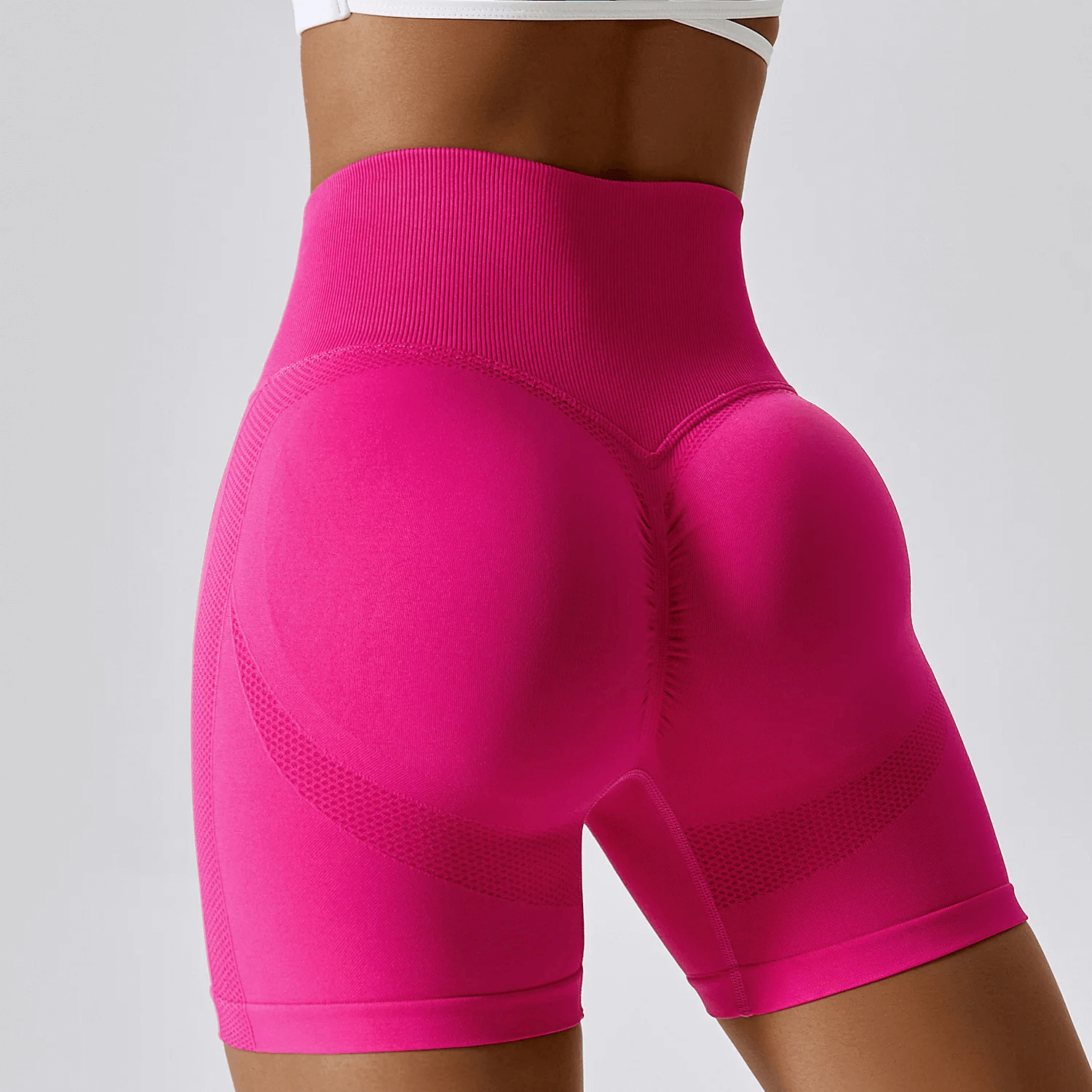 High-performance nylon spandex yoga shorts in pink, showcasing tailored fit and versatility for yoga, running, and cycling.