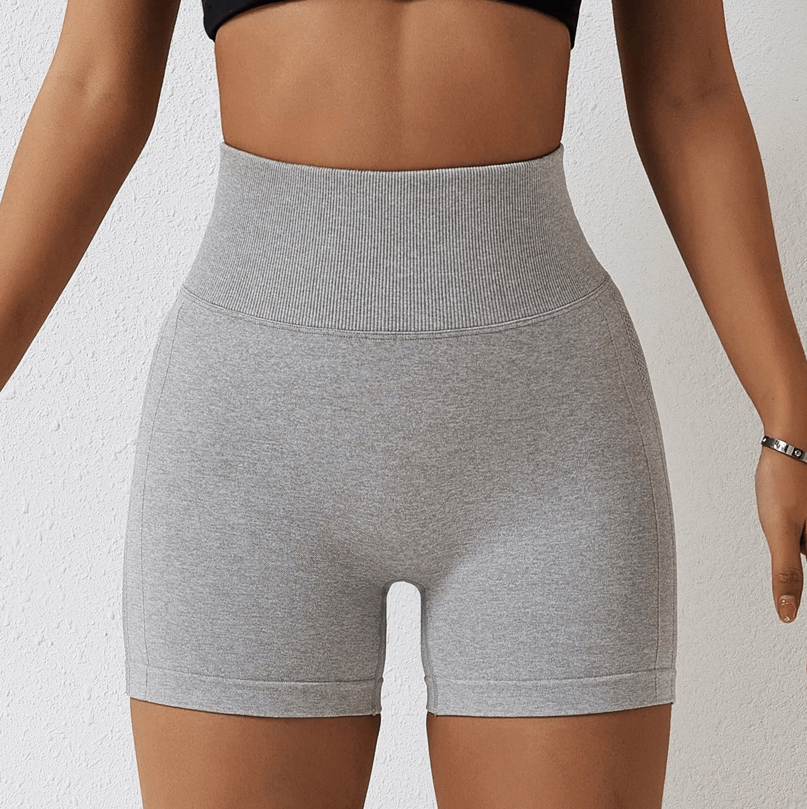 Woman wearing high-performance nylon spandex yoga shorts, showcasing a tailored fit for versatile athletic activities.