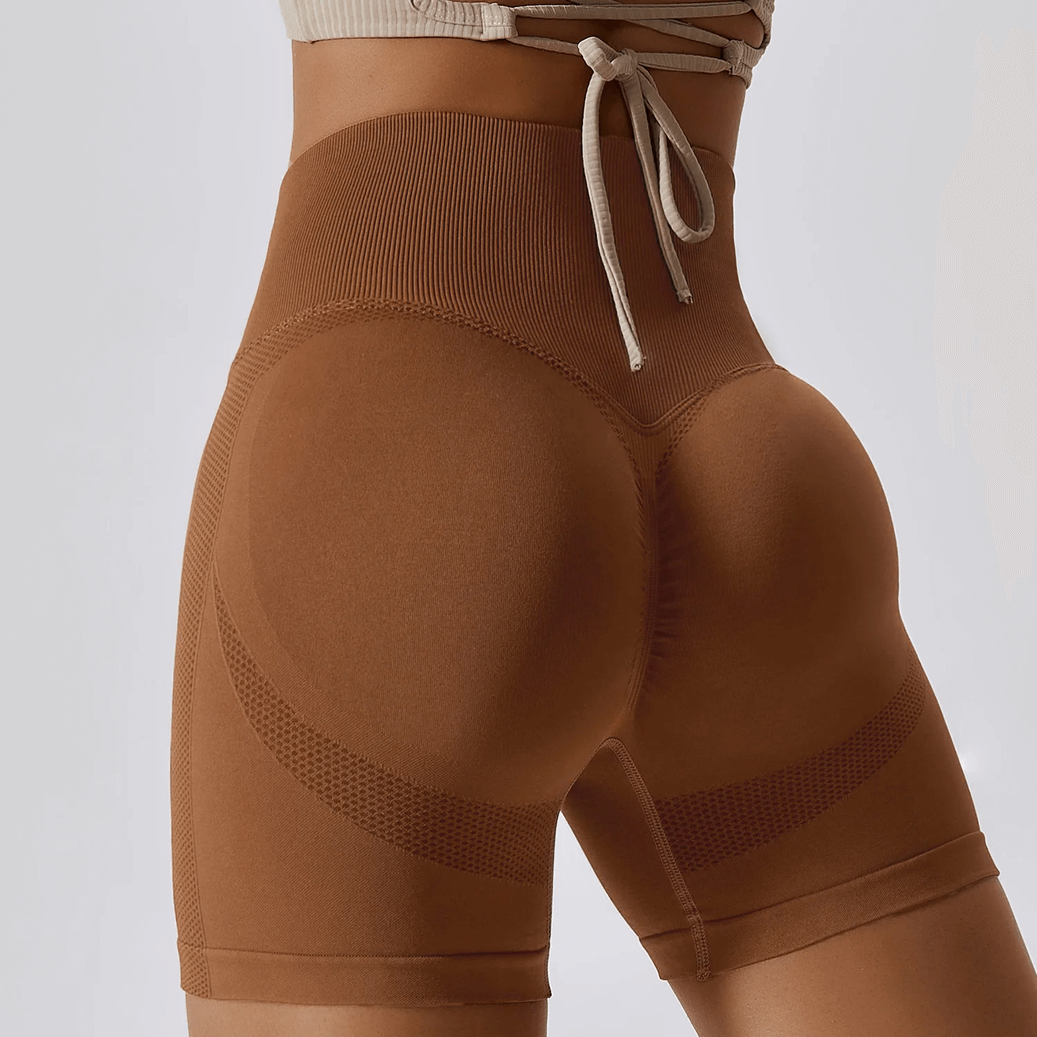 High-performance nylon spandex yoga shorts in brown, showcasing a snug fit and flexibility for yoga, running, and cycling.