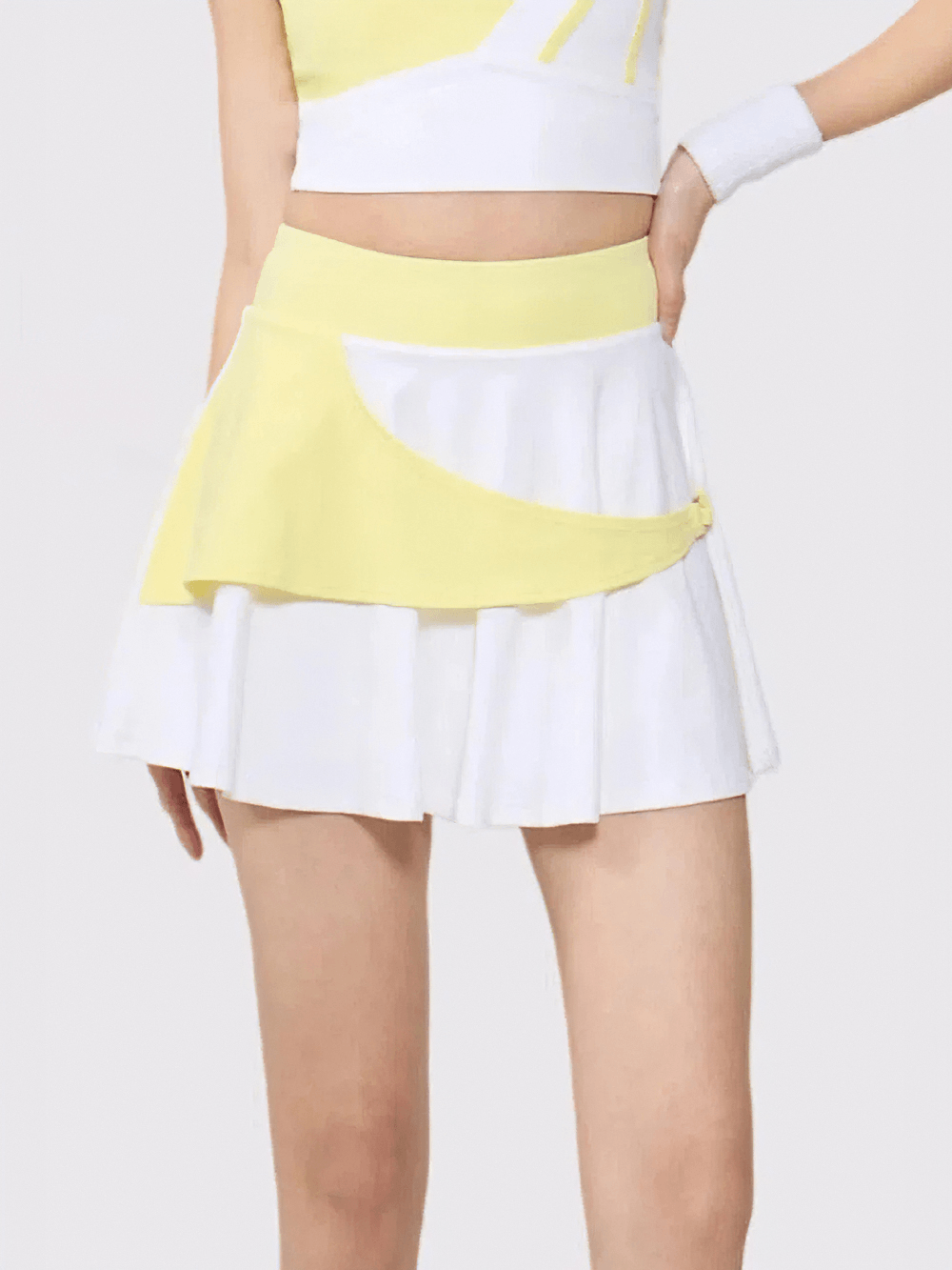 High Waist Color Block Tennis Skort With Liner - SF4578 showcasing a flared design in yellow and white.