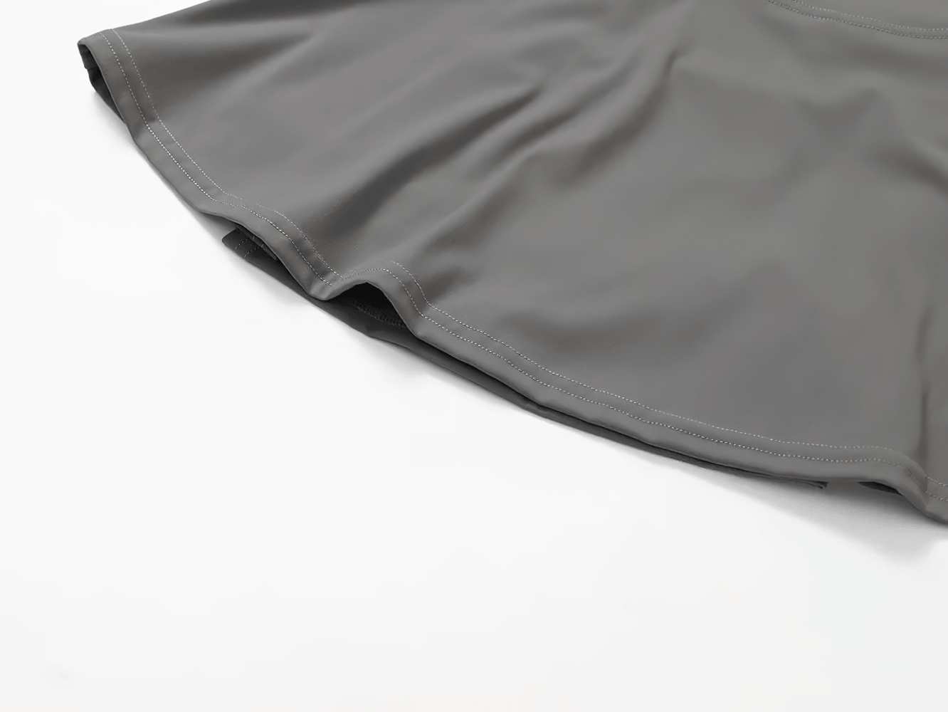 High Waist Fitness Skirt with Hidden Inner Shorts - SF4433, close-up of gray flared skort hem with built-in inner shorts and smooth high waist fit
