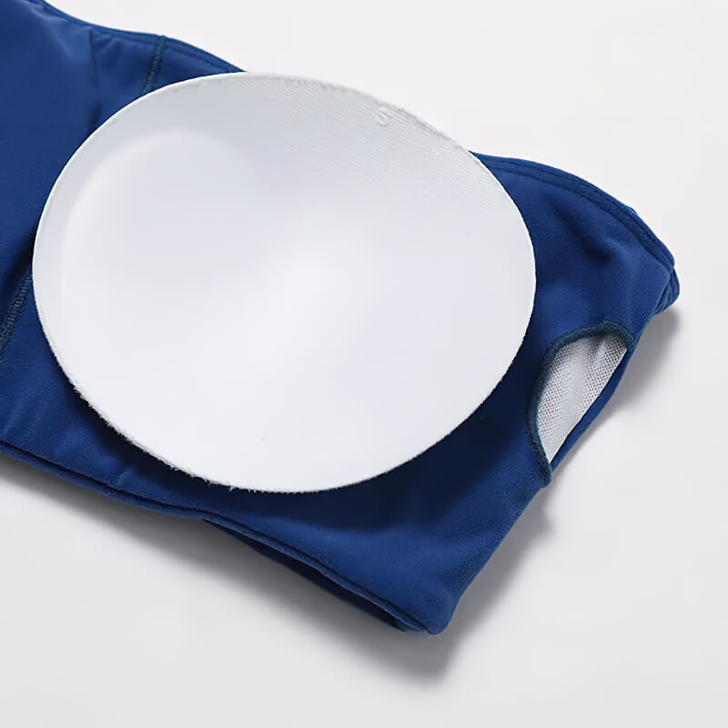 Close-up of blue push-up sports bra from yoga set with removable padding, highlighting comfort and support features for active wear.