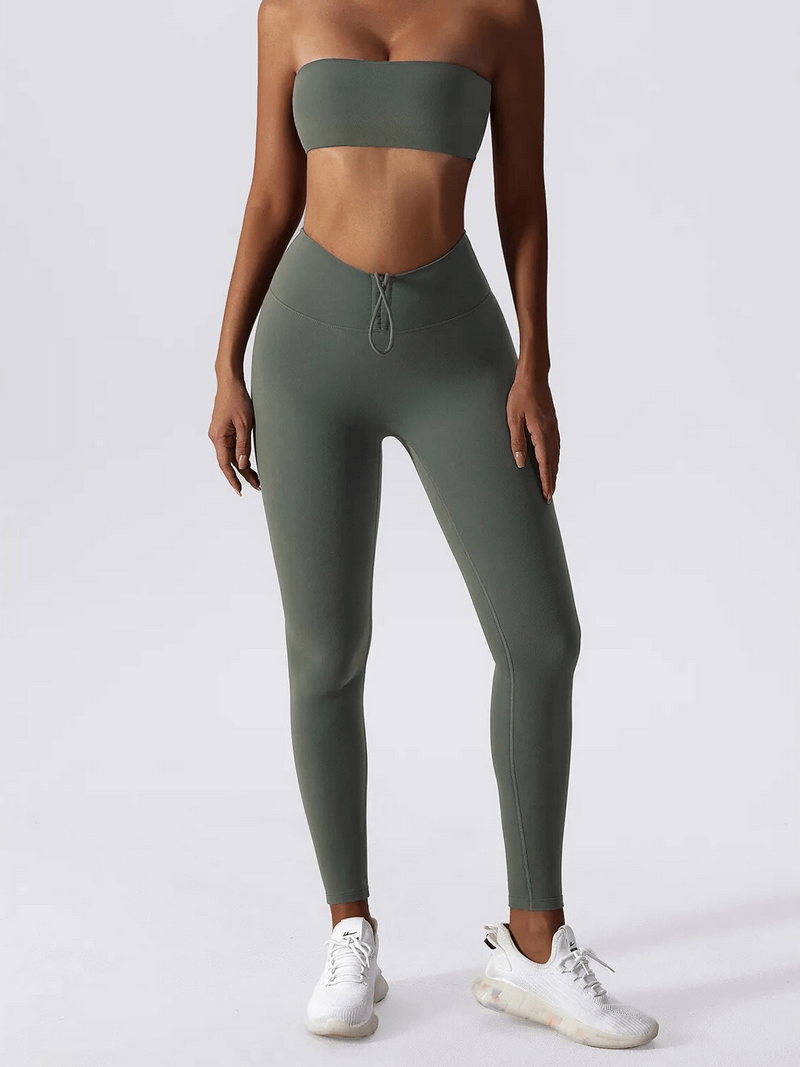 Model wearing high waist leggings and push up sports bra yoga set, perfect for fitness and comfort, in stylish grey color.