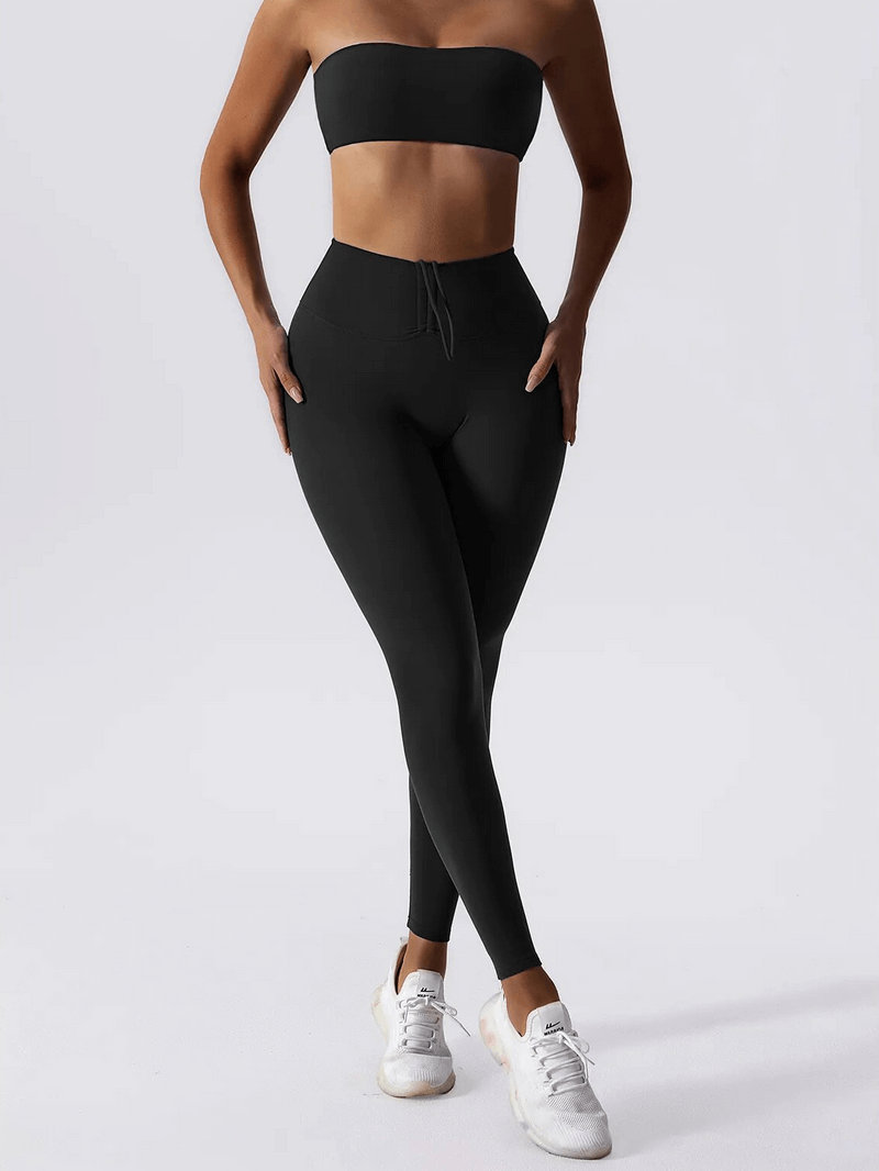Woman wearing High Waist Leggings and Push Up Sports Bra Yoga Set, SF1649, in black, showing comfort and fit ideal for fitness activities.