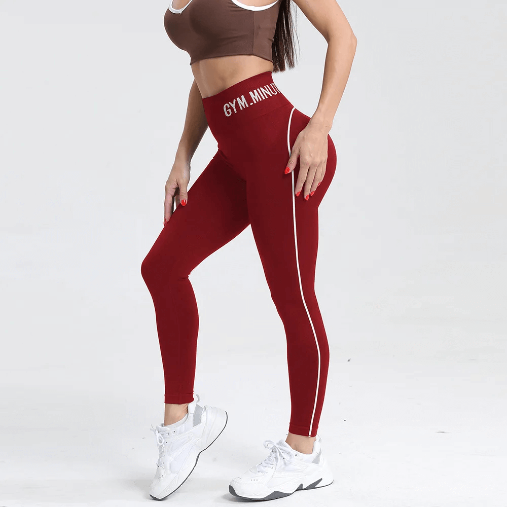 Woman wearing high-waist seamless contrast workout leggings SF4051 in red, showcasing gym fit with stylish color-contrast and quick-dry fabric.