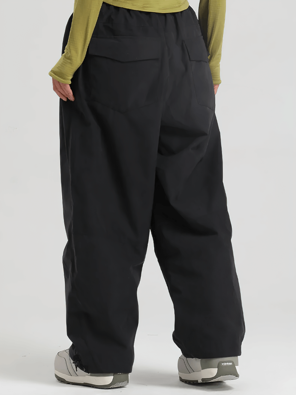 Back view of black High Waist Snowboard Pants with Vent Zippers - SF4241, showing loose fit and adjustable waist.