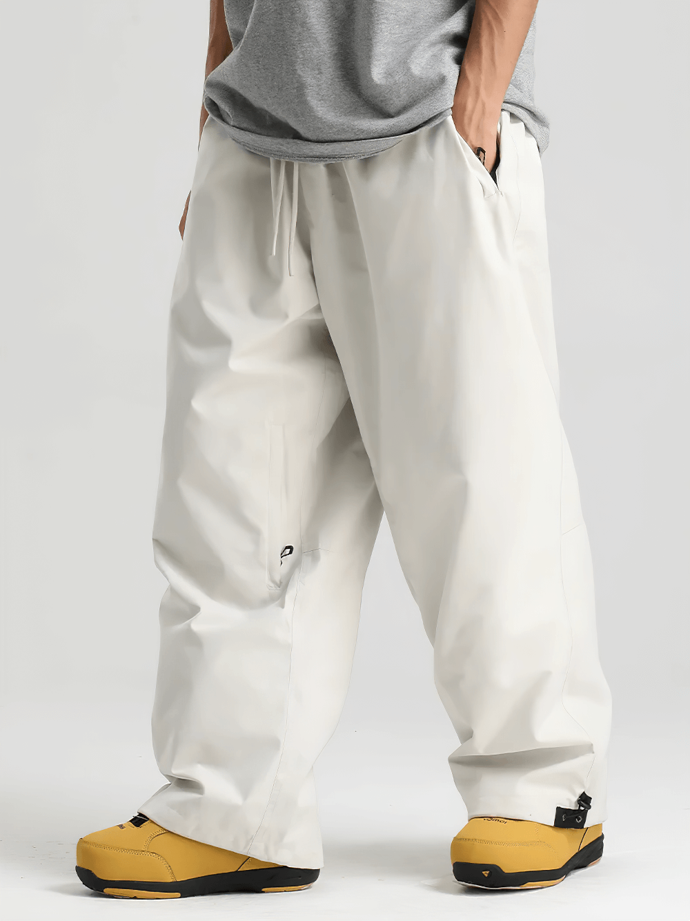 Model wearing High Waist Snowboard Pants with Vent Zippers - SF4241, showing adjustable waist and snow-proof cuffs.