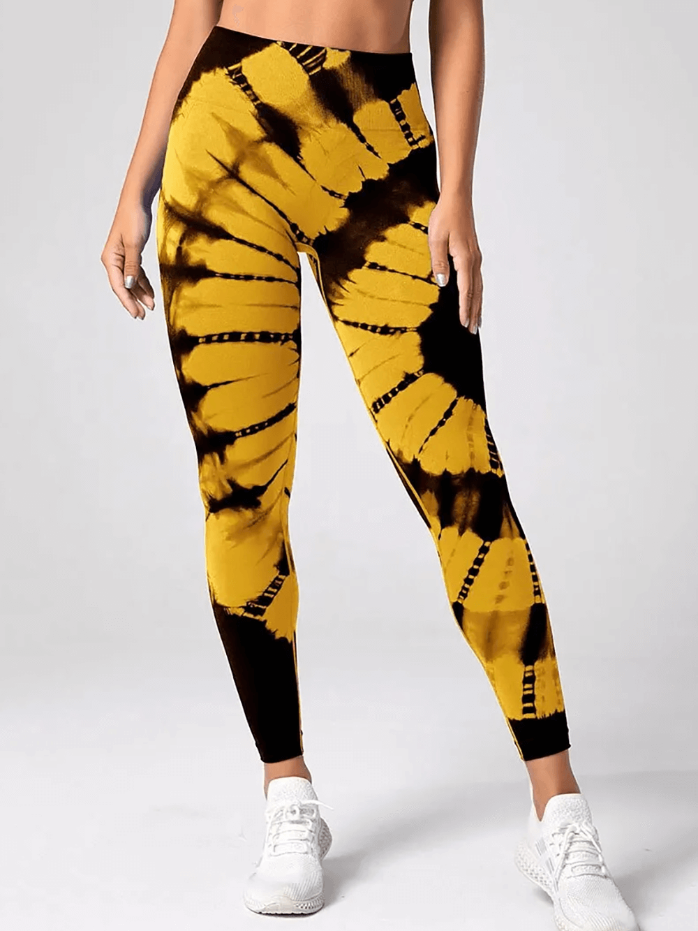 Woman wearing High Waist Tie Dye Seamless Scrunch Butt Leggings - SF4021 with yellow and black pattern for yoga and fitness.