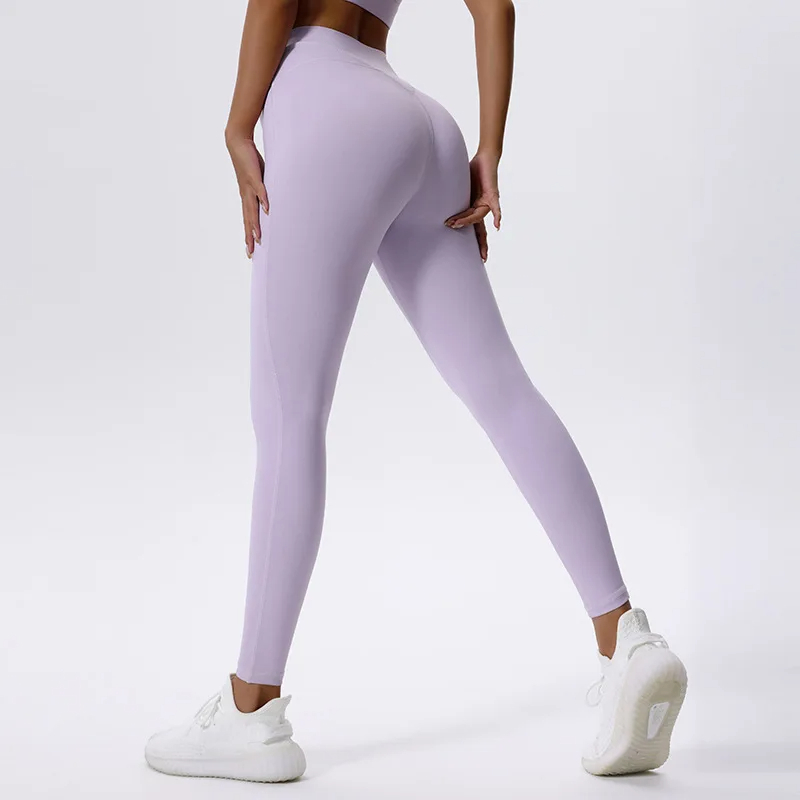 Woman wearing high waist lavender yoga pants SF2101, showcasing flexibility and style for workouts or yoga sessions.