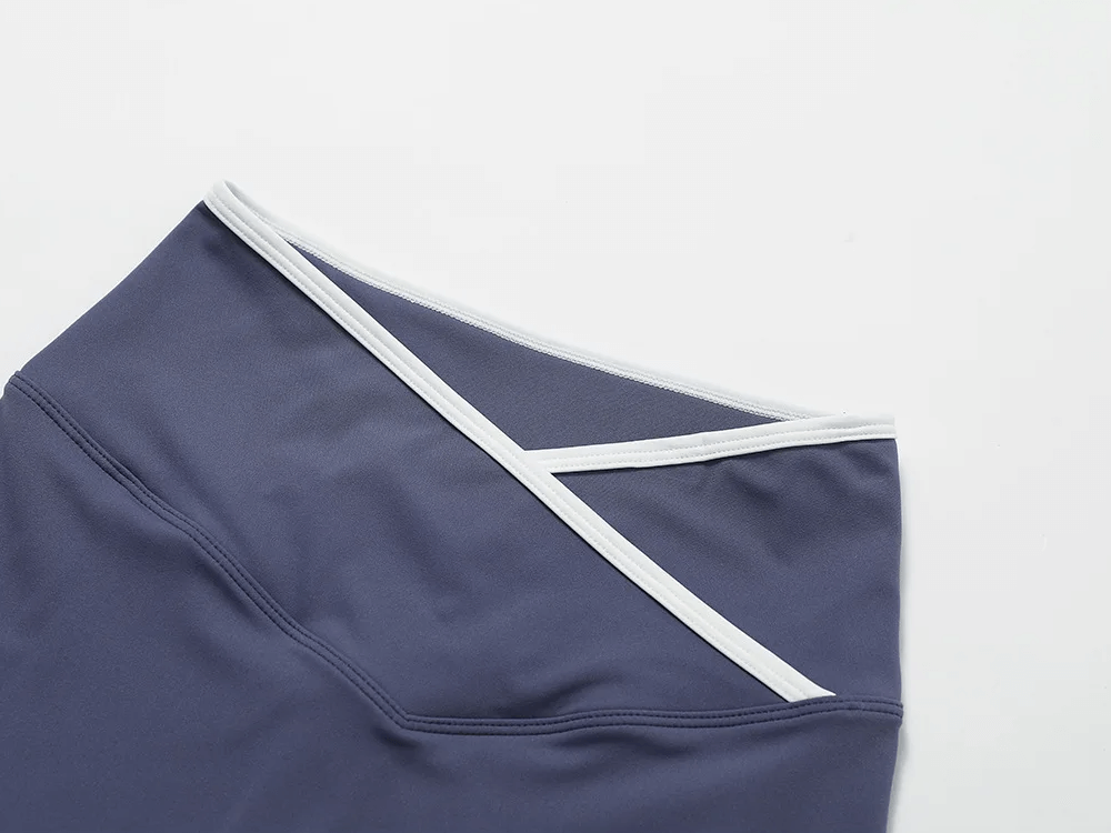 High waist yoga shorts with V-waist design in navy, featuring stretchy fabric for comfort and style, perfect for workouts or lounging.