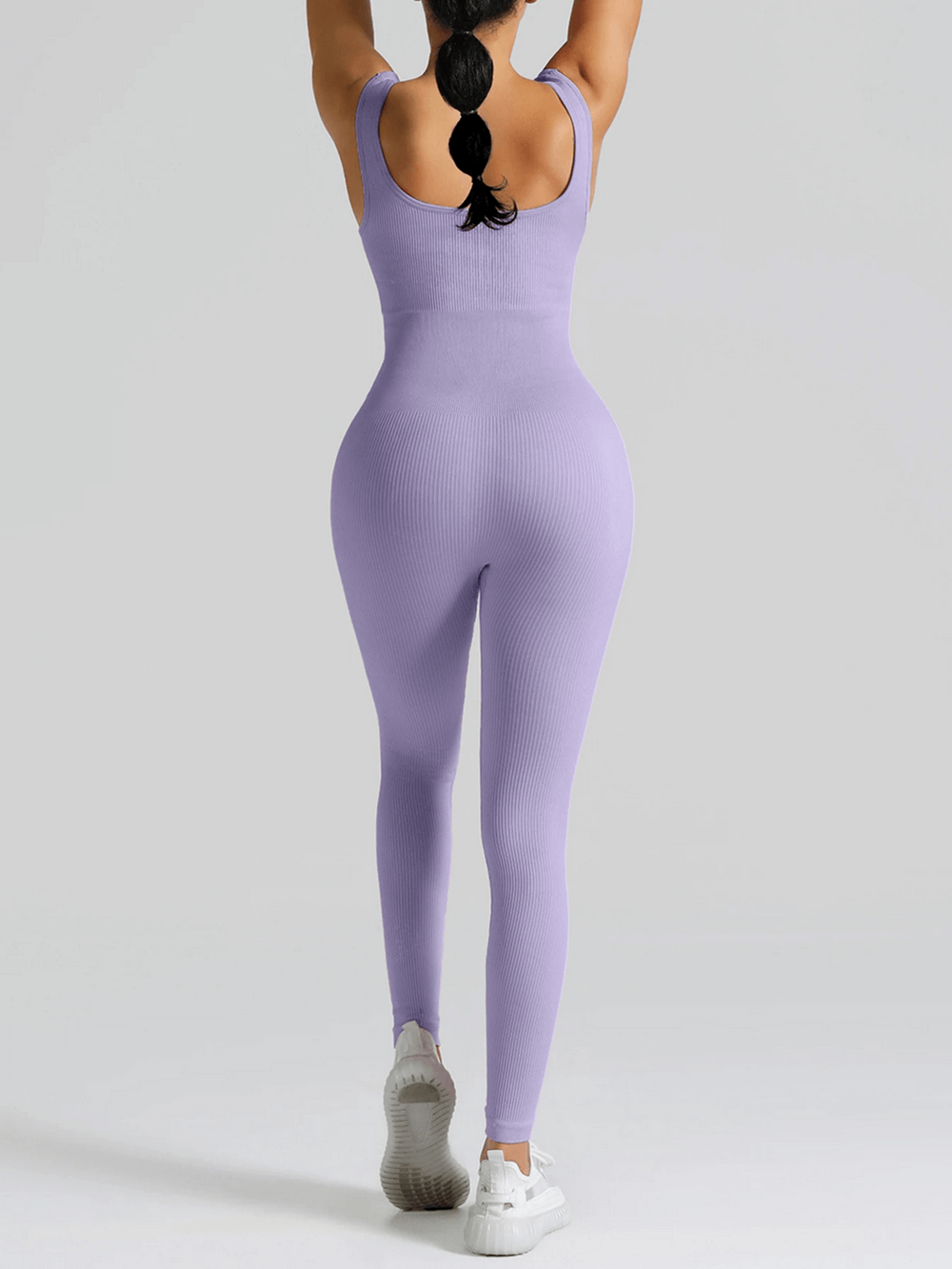 Alt Tag: High Waisted Seamless Yoga Jumpsuit for Women - SF4301 lavender seamless ribbed one-piece gym romper back view butt-lifting fit
