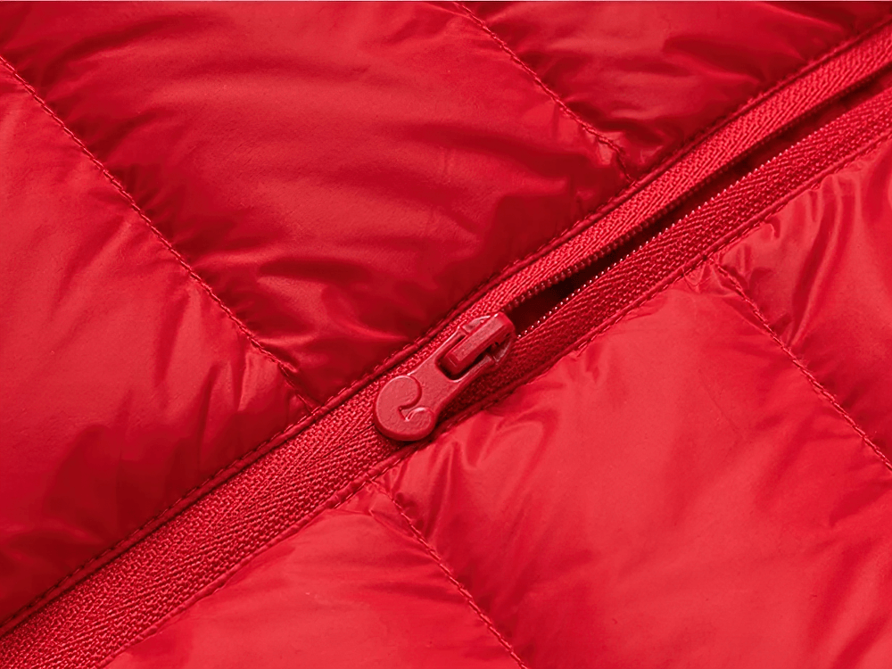 Close-up of red Hooded Down Jacket with Waterproof Outer Shell - SF3510 showing puffer material and zipper detail.