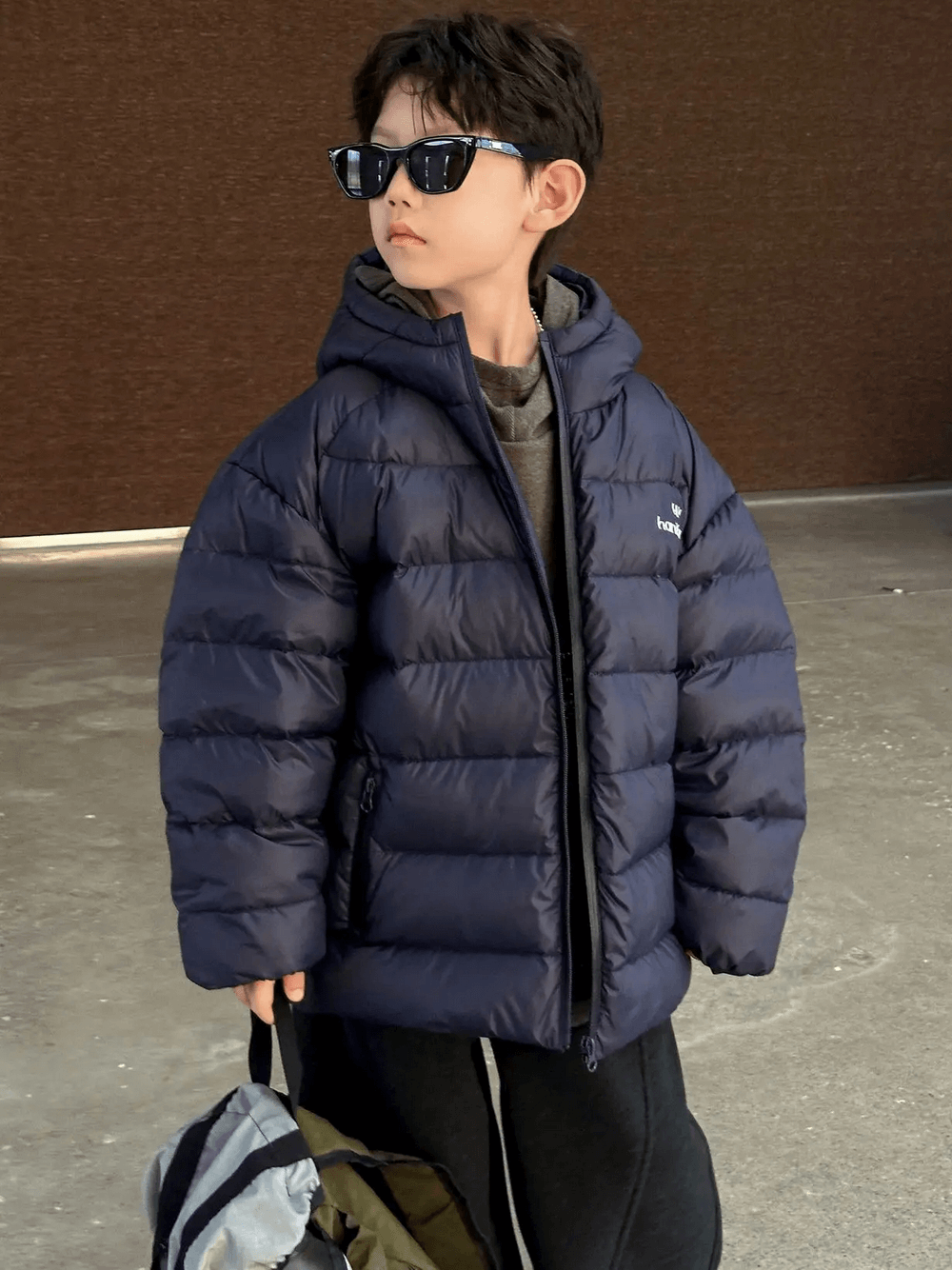 Boy wearing the Hooded Puffer Jacket with Zipper and Insulation - SF3640, styled for winter, showing padded and insulated features.