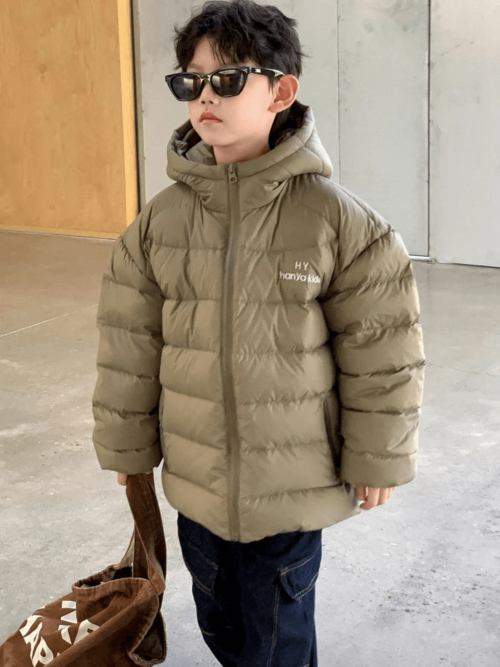 Boy wearing Hooded Puffer Jacket with Zipper and Insulation - SF3640, showcasing warm padded design with hood and easy-zip front.