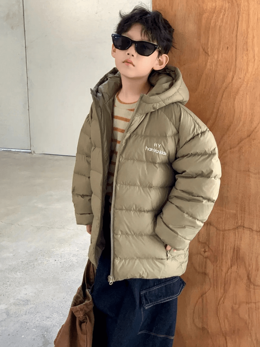 Boy wearing Hooded Puffer Jacket with Zipper and Insulation - SF3640, standing confidently in a stylish winter outfit.