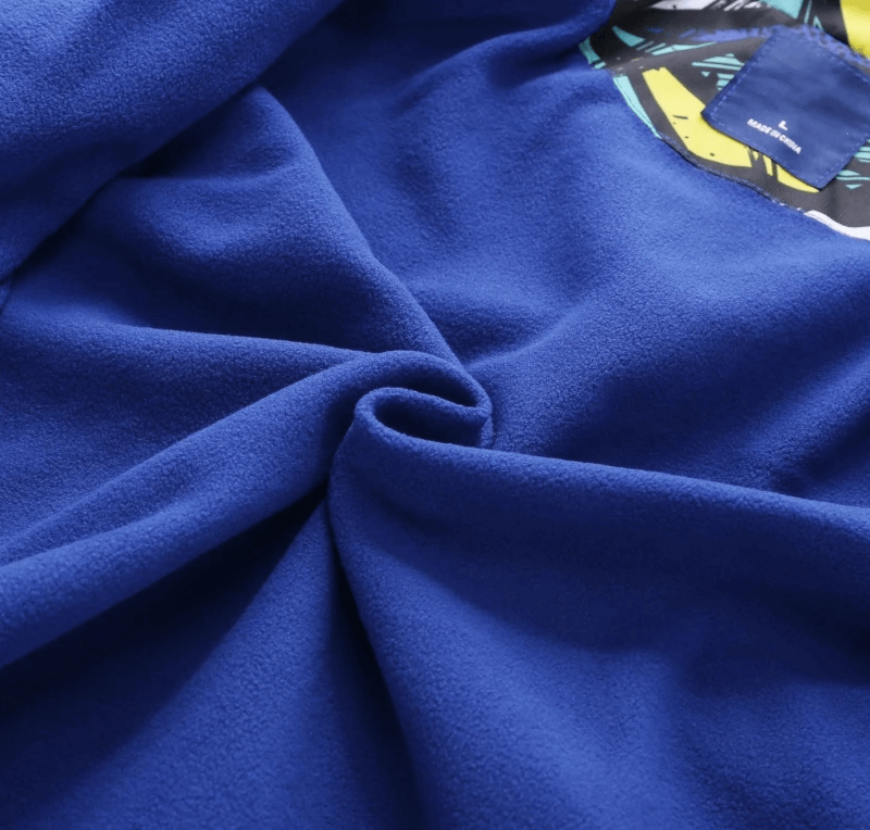 Close-up of blue fabric material from Hooded Windbreaker Jacket with Camo Print - SF3847 showcasing texture and quality.
