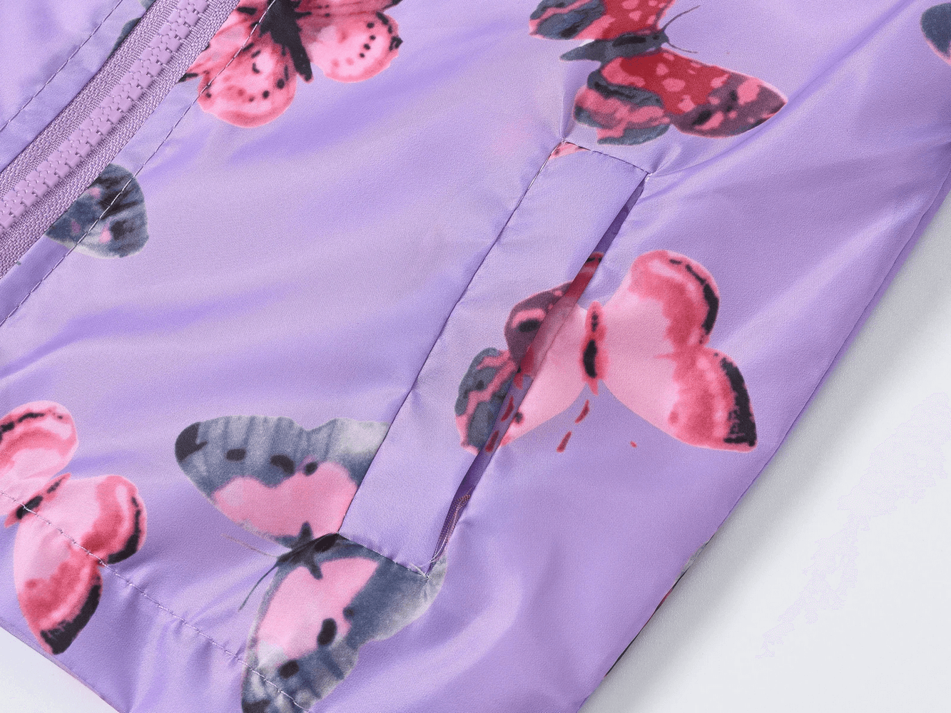 Close-up of Hooded Windbreaker Jacket with Printed Cute - SF3633 showcasing vibrant floral and butterfly prints on a violet fabric.