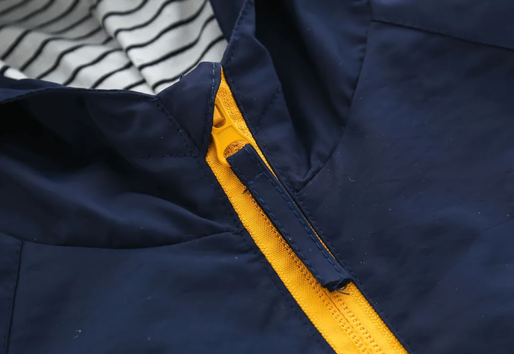 Close-up of Hooded Windbreaker Jacket with Zip Front - SF3602 showing yellow zipper and striped inner hood.