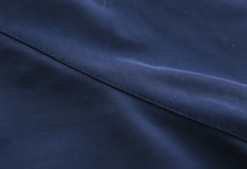 Close-up texture of Hooded Windbreaker Jacket with Zip Front - SF3602 in deep blue fabric