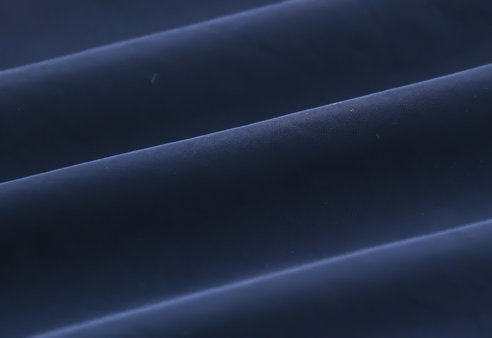 Close-up texture of fabric from Hooded Windbreaker Jacket with Zip Front - SF3602, showcasing its durable and lightweight material for weather protection.