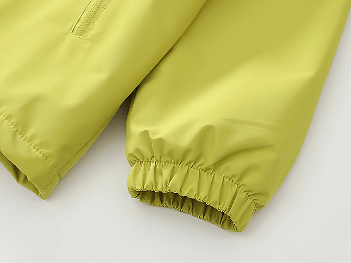 Close-up of Kids' Hooded Windproof and Waterproof Outdoor Jacket - SF3563 sleeves in vibrant green, perfect for spring and autumn adventures.