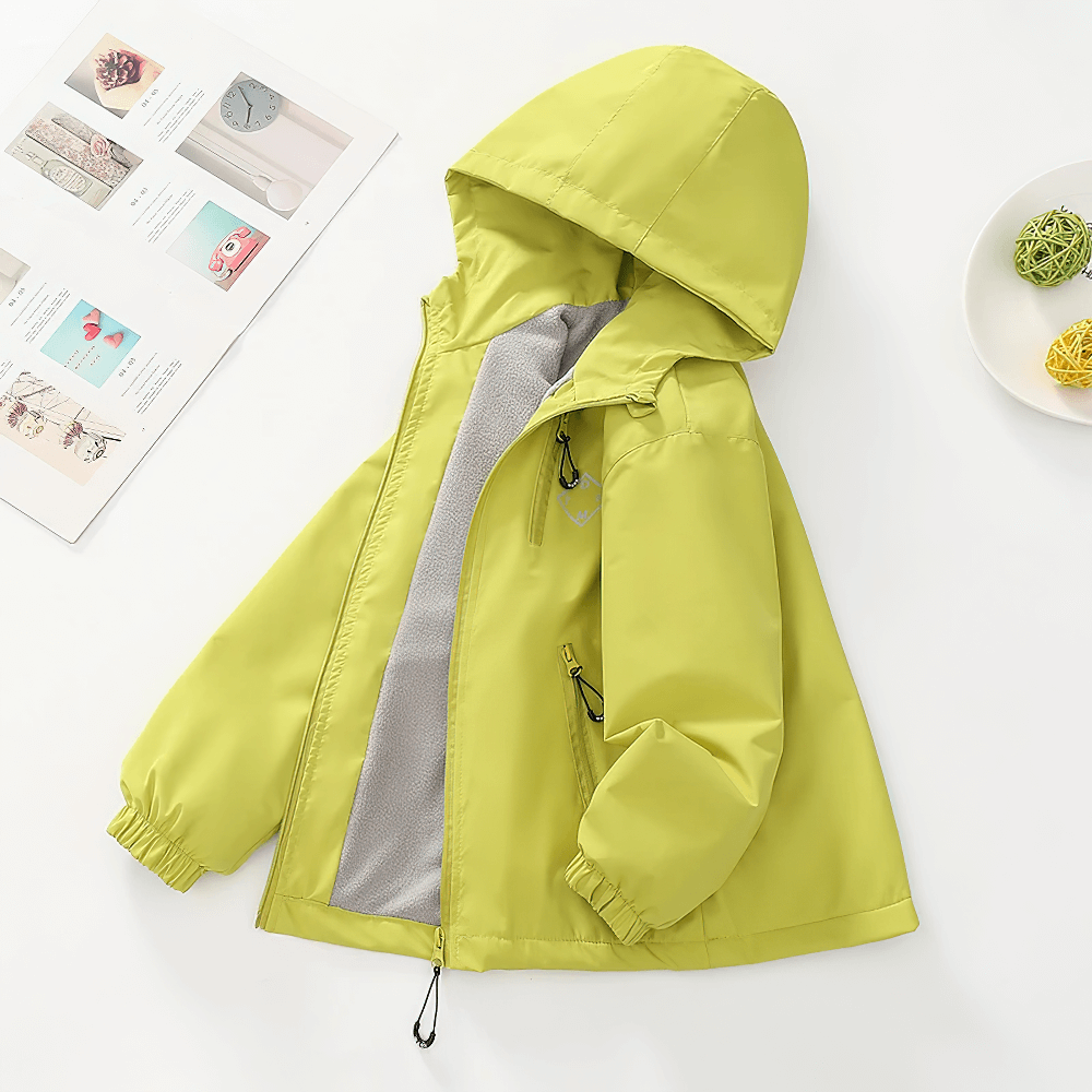 Bright yellow Hooded Windproof and Waterproof Outdoor Jacket - SF3563 for kids, perfect for hiking and outdoor sports, shown on a table.