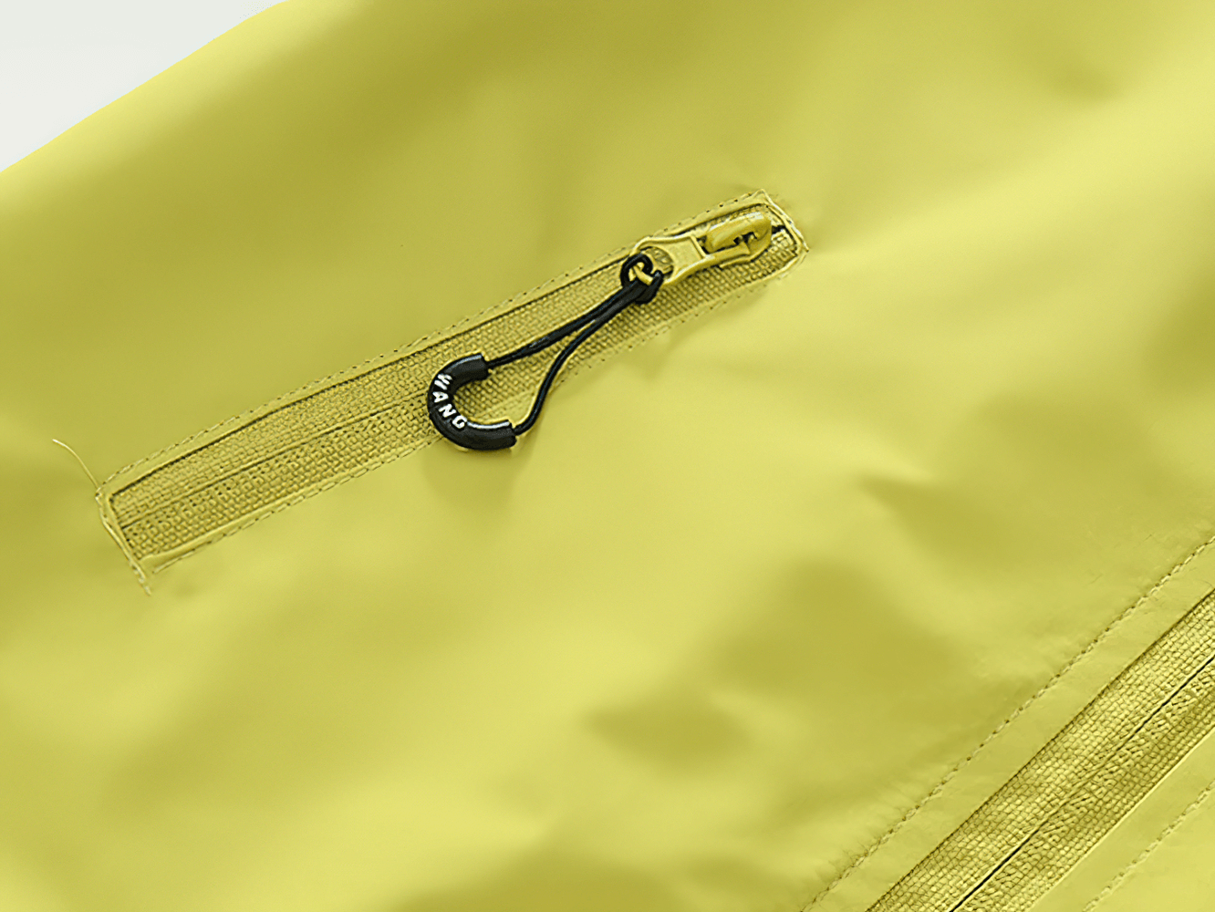 Close-up of zip detail on Hooded Windproof and Waterproof Outdoor Jacket - SF3563 in vibrant yellow, showcasing durable design.