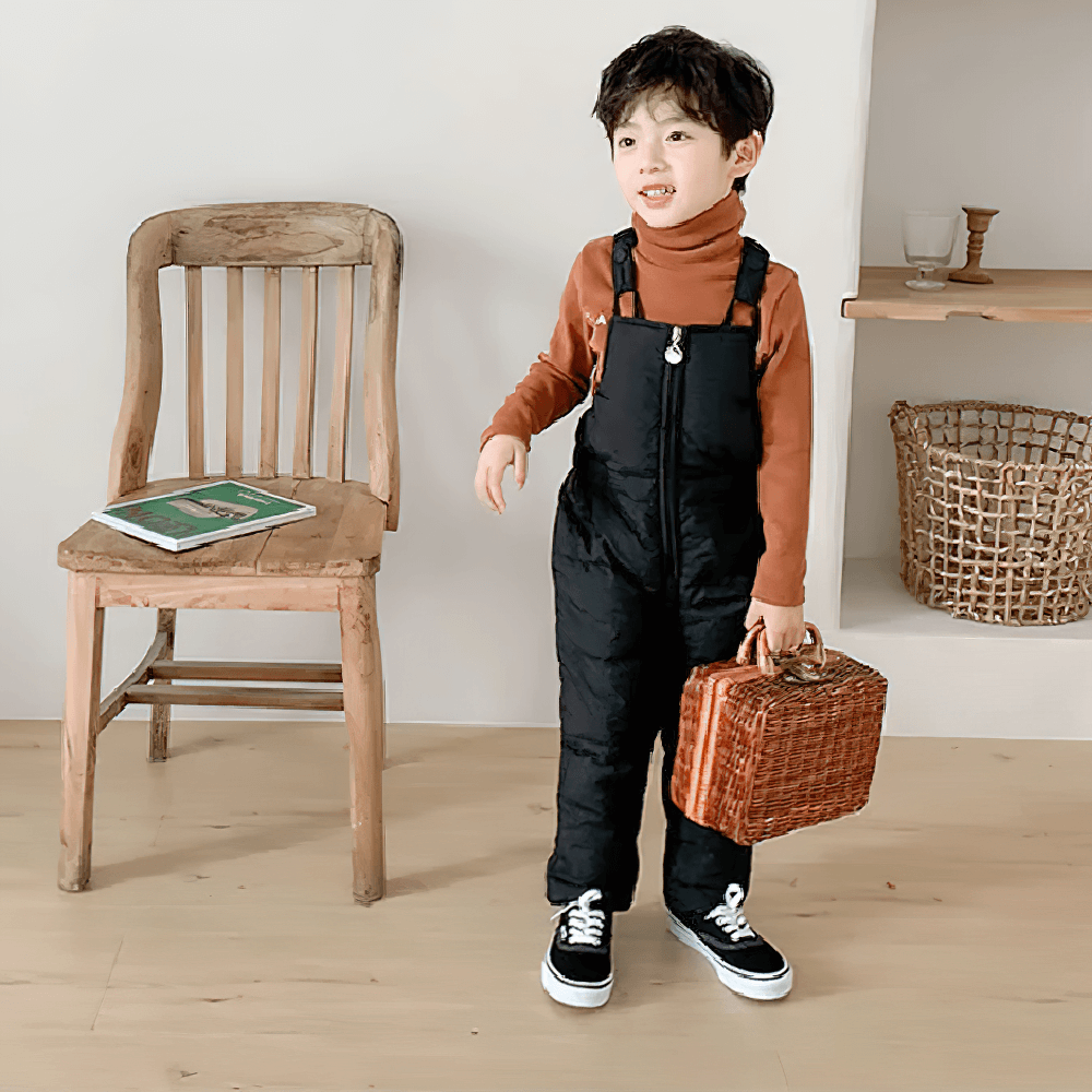 Child wearing Insulated Snow Bib Pants for Boys and Girls - SF3731, holding a basket, standing indoors