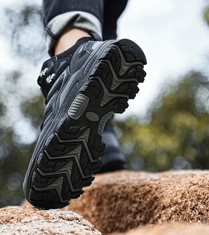 Trekking in Insulated Unisex Leather Hiking Boots SF1634, showcasing rugged rubber tread and waterproof design.