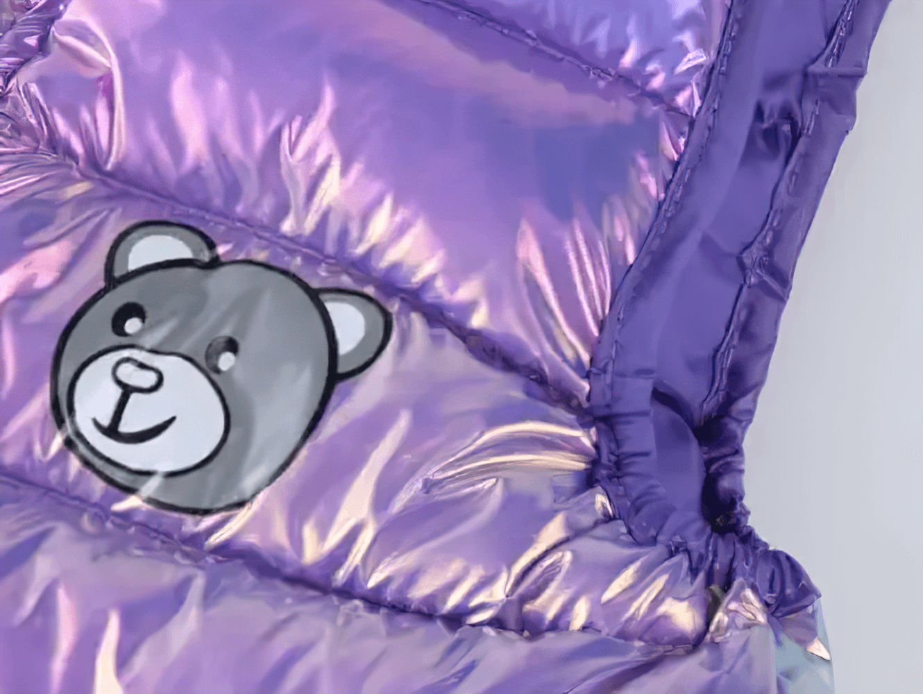 Close-up of Iridescent Kids Winter Down Cotton Strap Snow Pants - SF3770 with bear design, highlighting the shiny, insulated material.