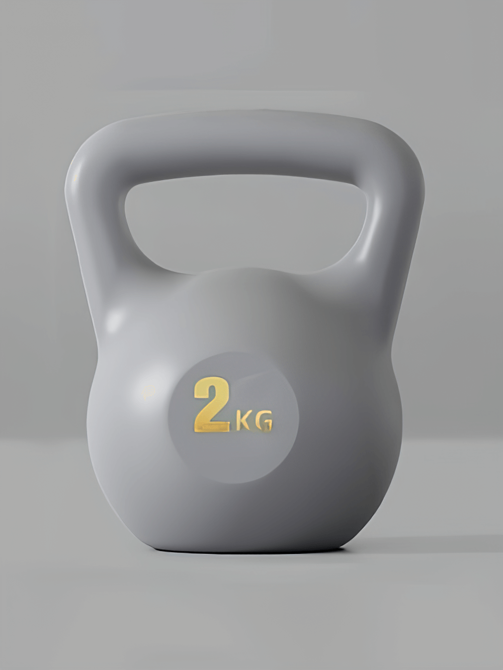 Grey 2kg ergonomic kettlebell with soft impact-resistant exterior for home and gym workouts, perfect for squats and swings.