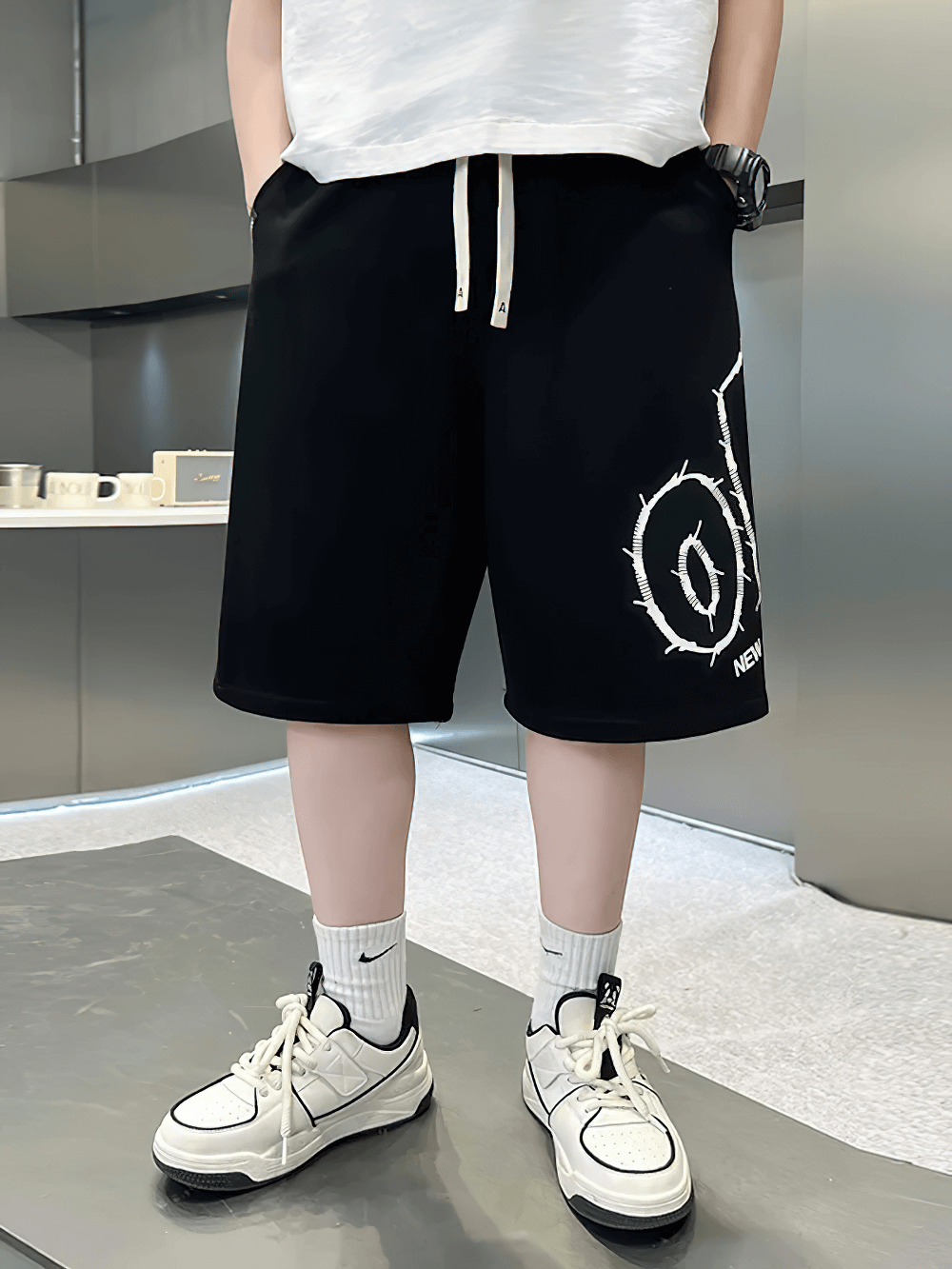 Kids Baggy Cotton Shorts with Graphic Print - SF3891 worn by a kid, showcasing casual style with drawstrings and bold print.