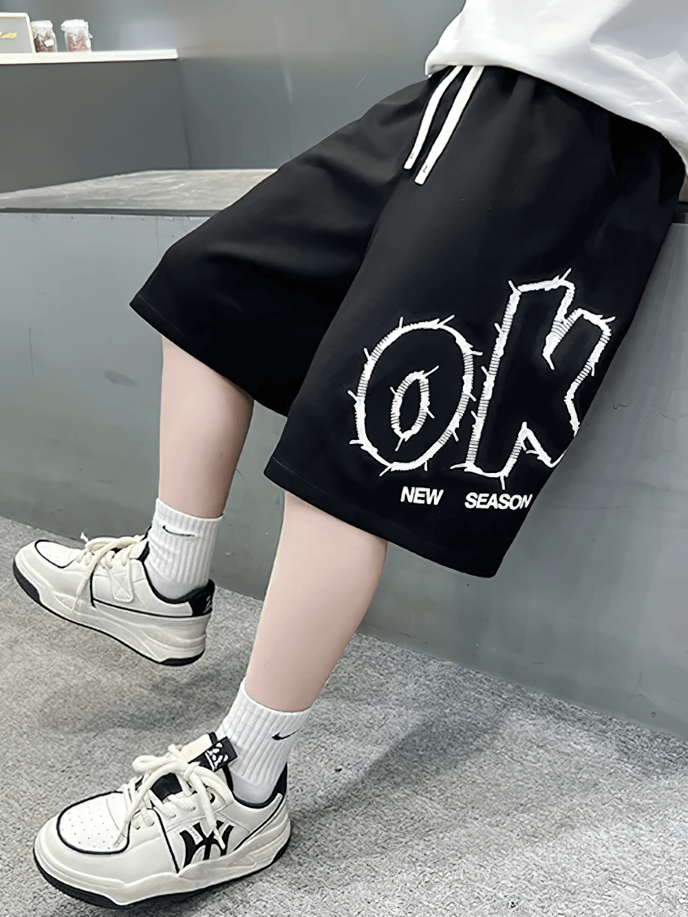 Kids Baggy Cotton Shorts with Graphic Print - SF3891, black with bold letter print, showing casual style and elastic waistband.