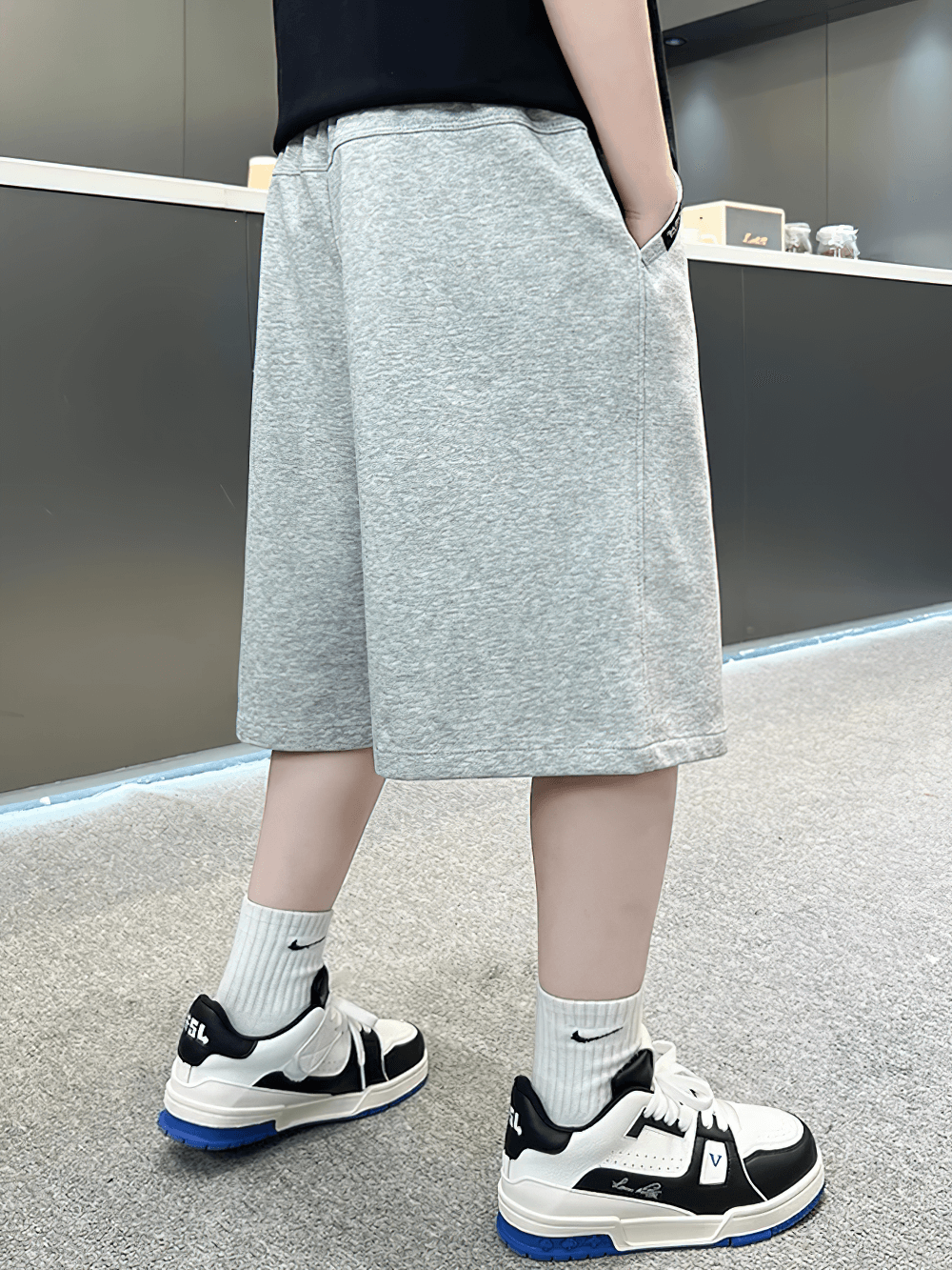 Side view of Kids Baggy Cotton Shorts with Graphic Print - SF3891 in grey, showcasing casual baggy fit and knee-length style.