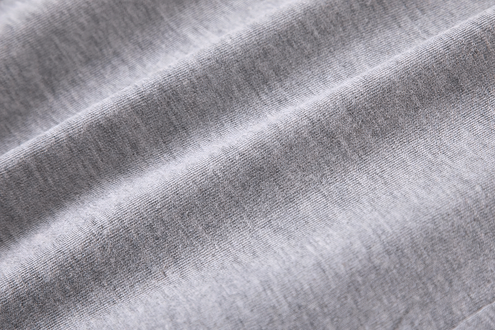 Close-up of soft grey fabric used in Kids Basic Elastic Waistband Cotton Shorts - SF3820, showcasing texture and quality.