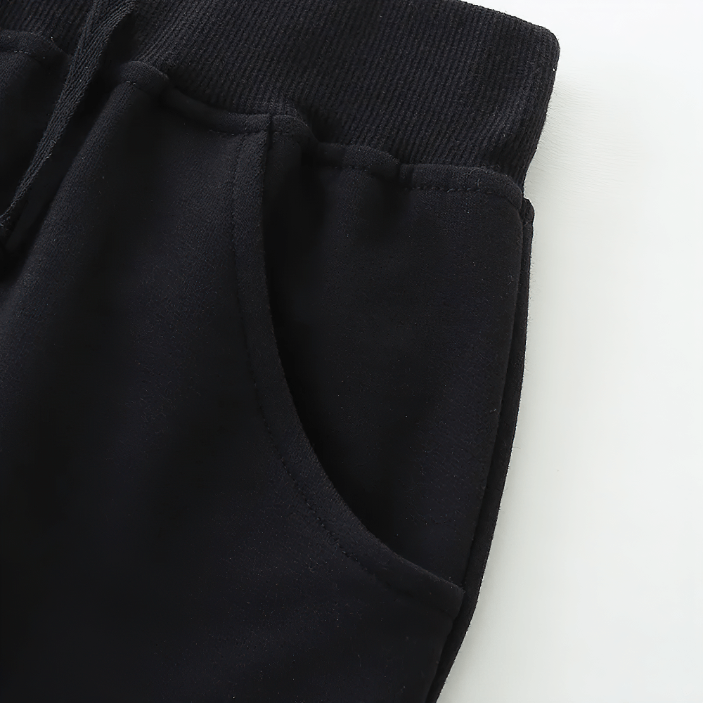 Close-up of Kids' Black Shorts with Pockets and Elastic Waist - SF3825, showcasing the elastic waistband and pocket detail.