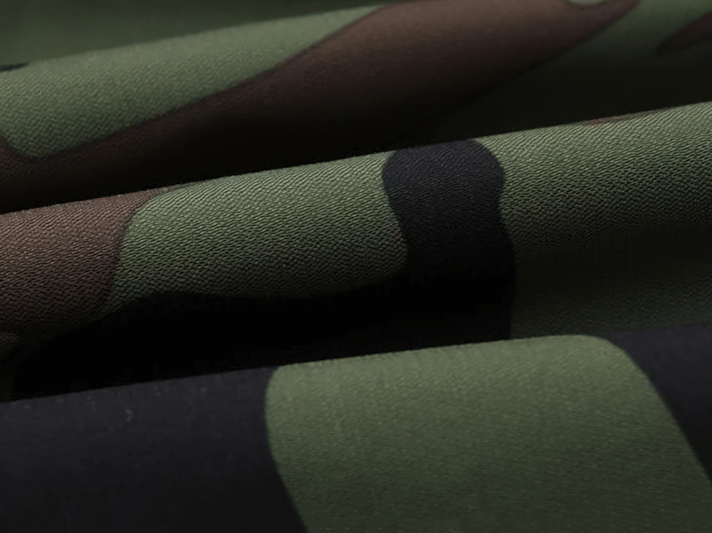 Close-up of fabric on Kids Camouflage Hooded Windbreaker Jacket - SF3642 showing green, brown, and black camouflage pattern.