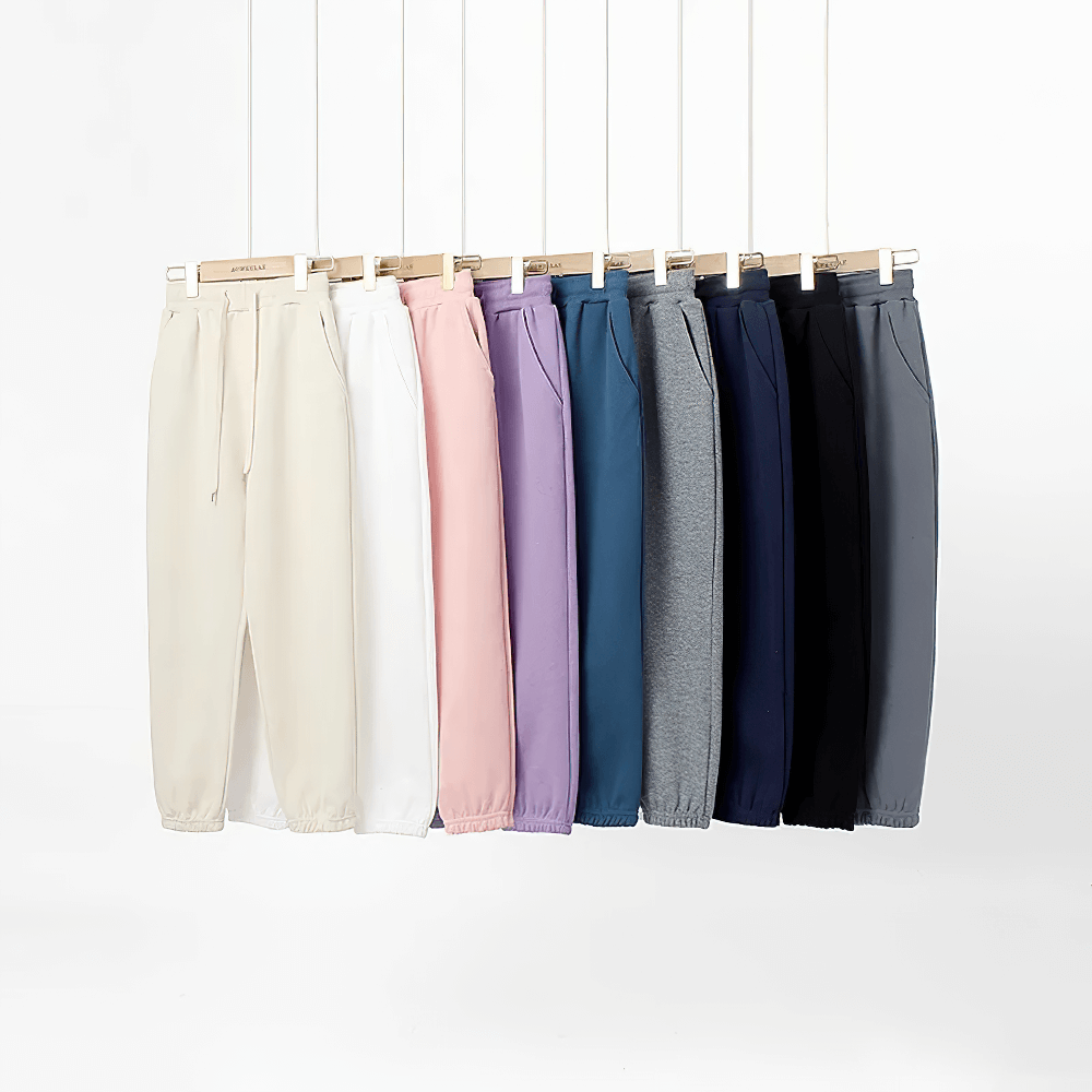 Colorful collection of Kids Casual Sports Jogger Pants with Pockets - SF3612 in various colors displayed on hangers.