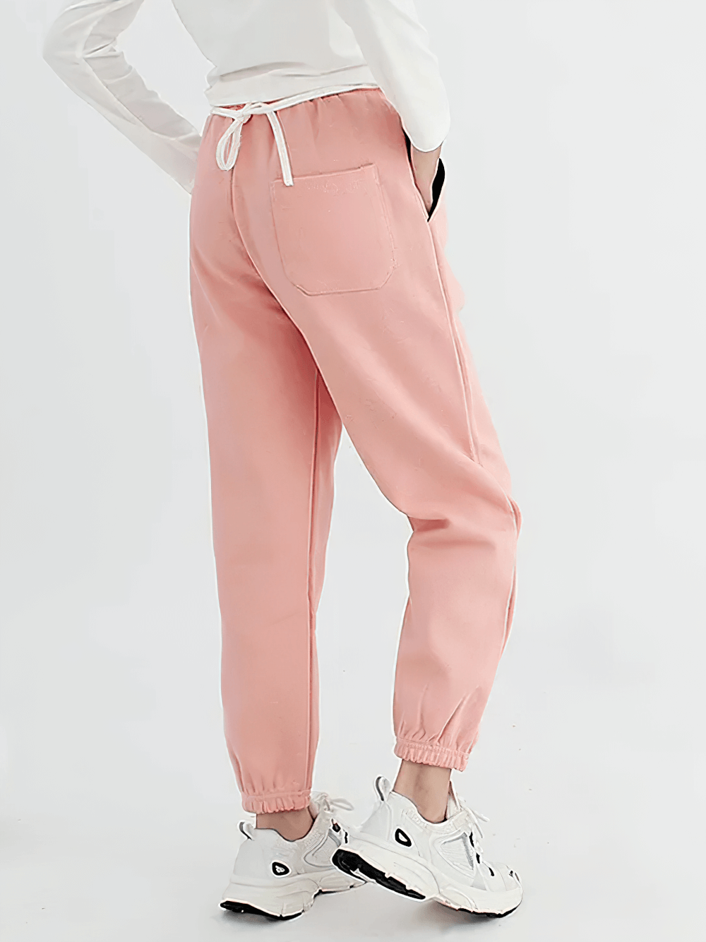 Rear view of Kids Casual Sports Jogger Pants with Pockets - SF3612 in pink, featuring drawstring waist and side pockets.