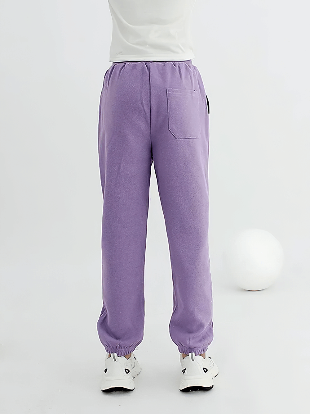Back view of Kids Casual Sports Jogger Pants with Pockets - SF3612 in purple, highlighting elastic waist and back pocket design.