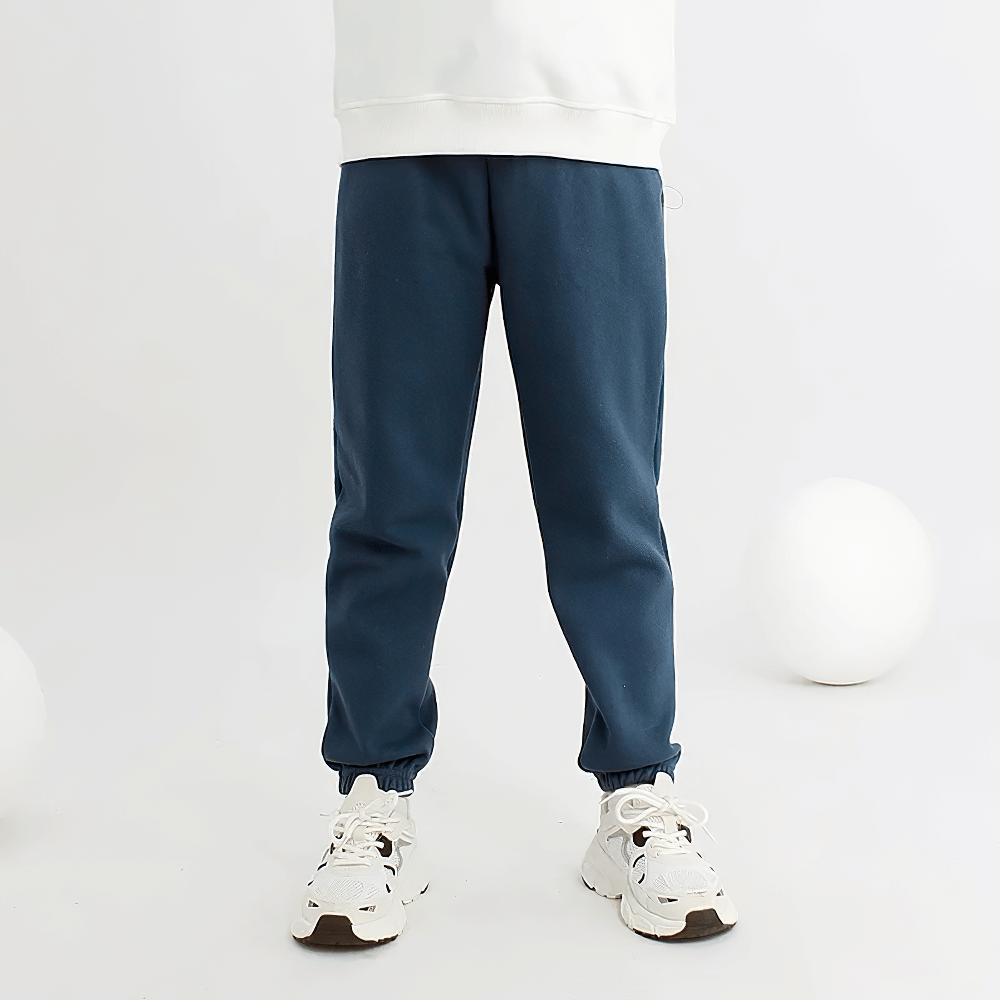 Child wearing Kids Casual Sports Jogger Pants with Pockets - SF3612, featuring a drawstring waist and stylish stitching details.
