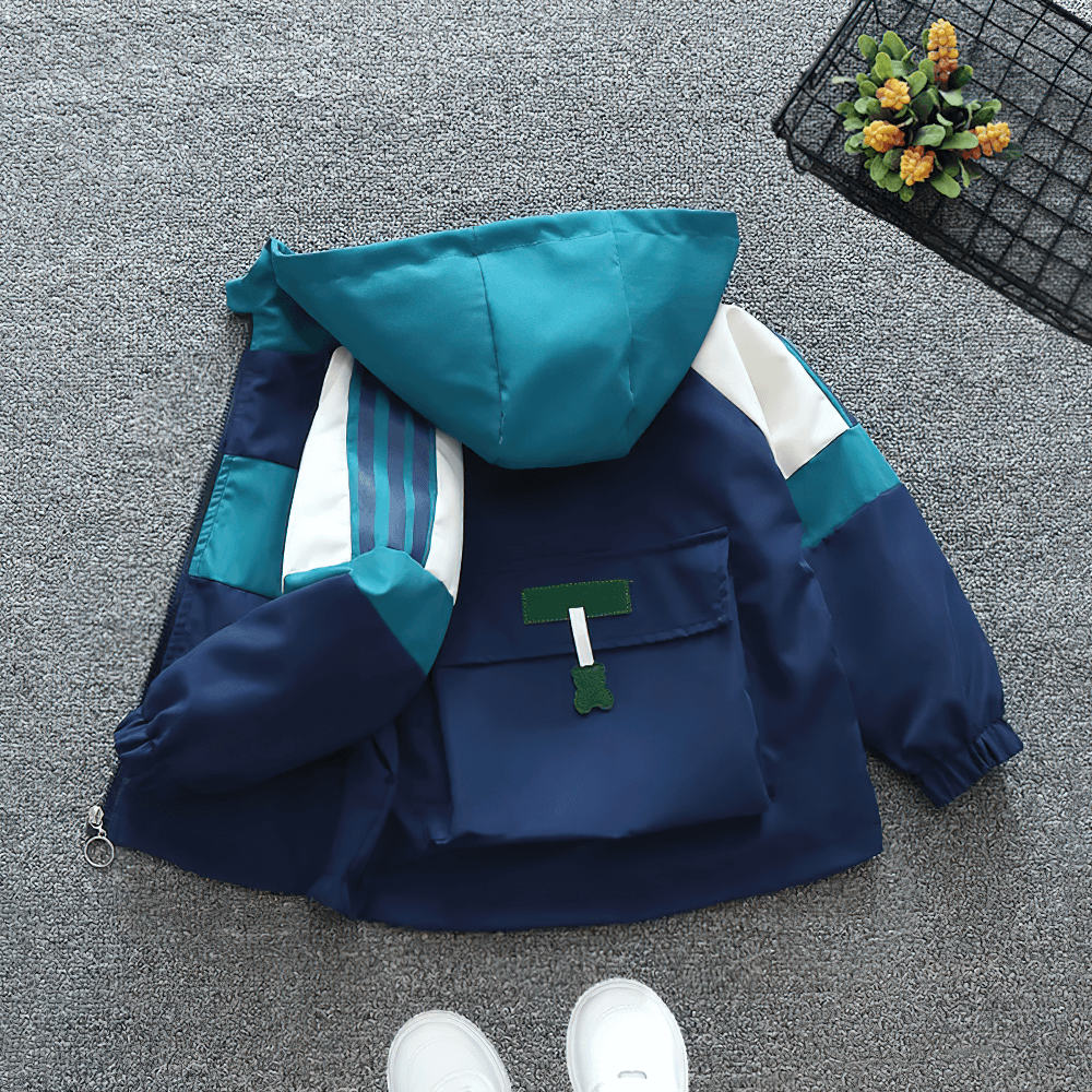 Kids teal/navy colorblock windbreaker jacket with hood, elastic cuffs, and front zipper perfect for outdoor activities - SF3127.