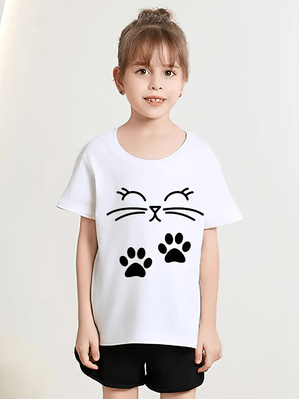 Kids Cute Cat Print Short-Sleeved T-Shirt - SF3867 worn by a smiling child, showcasing playful kitty and paw prints on soft cotton fabric.