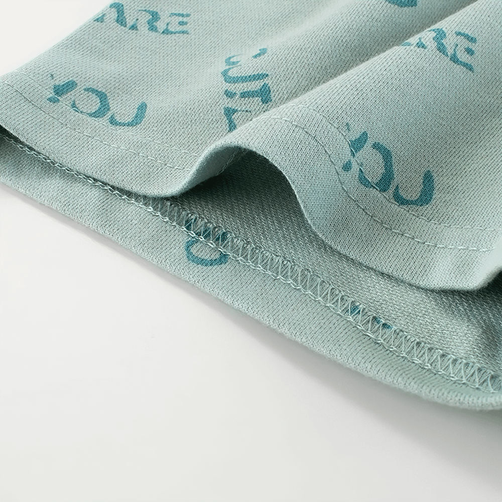 Close-up of soft knit fabric on Kids' Cute Print Soft Knit Shorts for Sport - SF3786, showcasing smooth texture and playful print design.