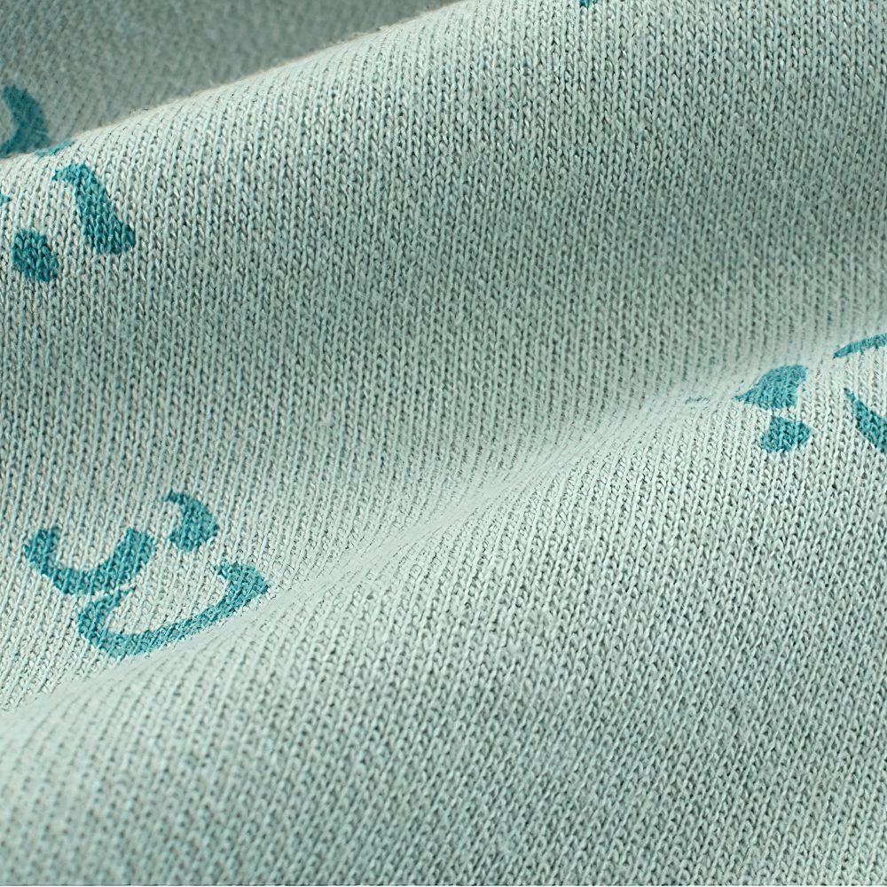 Close-up of soft knit fabric from Kids' Cute Print Soft Knit Shorts for Sport - SF3786, featuring playful graphic print details.