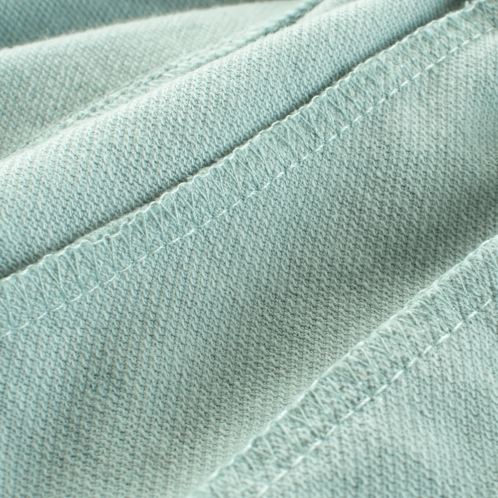 Close-up of soft knit fabric from Kids' Cute Print Soft Knit Shorts for Sport - SF3786 in textured aqua color